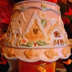 Candle with topper shade.